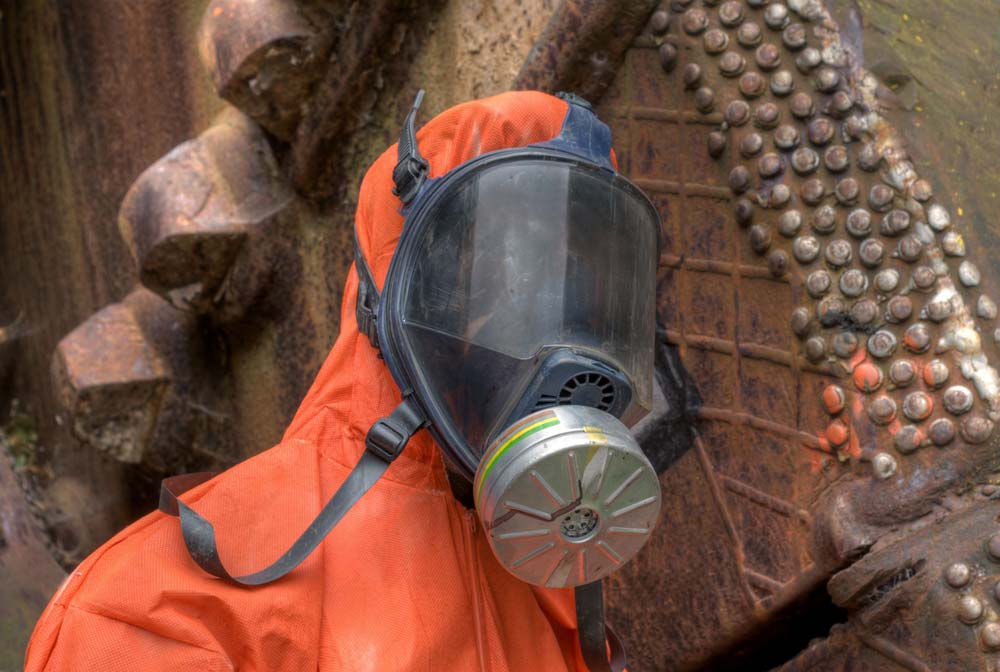 HAZWOPER respirator in use by worker