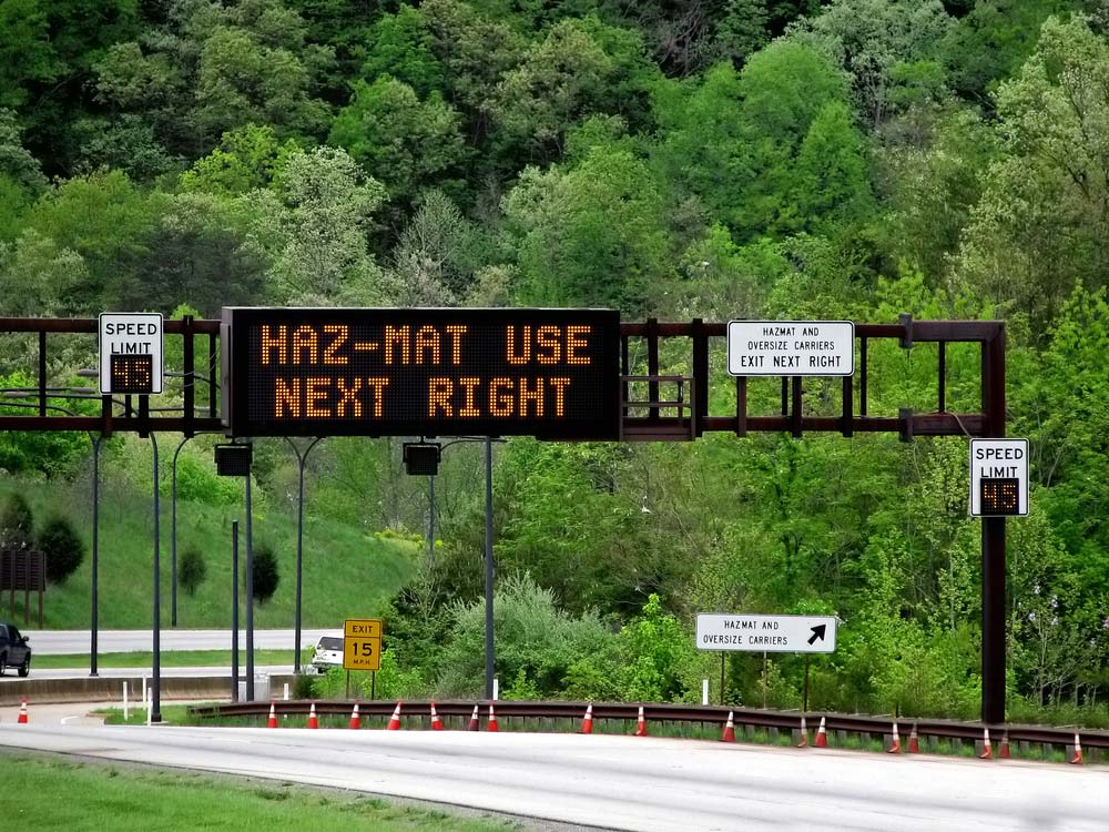 hazmat sign to detour road traffic